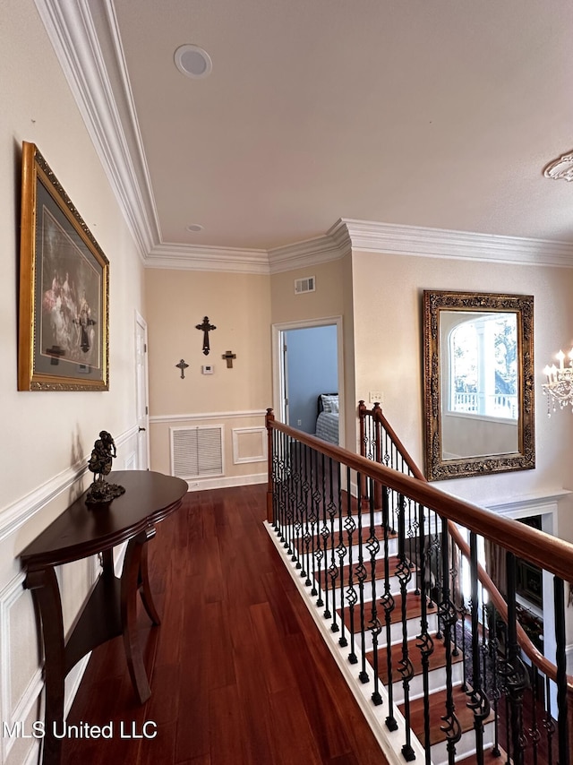 corridor featuring crown molding and dark hardwood / wood-style floors