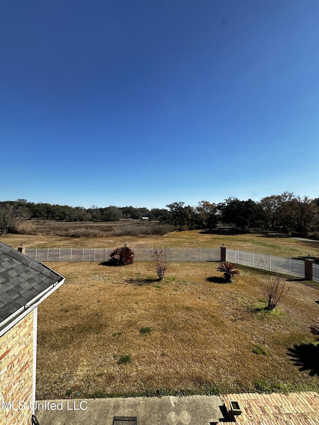 view of yard with a rural view