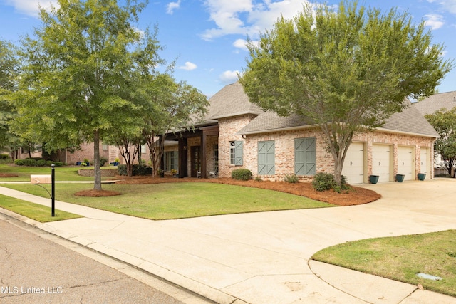 view of front of property featuring a garage and a front lawn