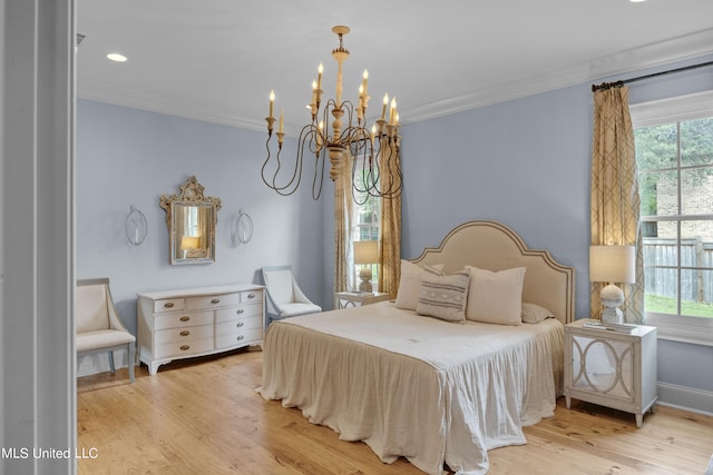 bedroom featuring light hardwood / wood-style floors, a notable chandelier, multiple windows, and crown molding