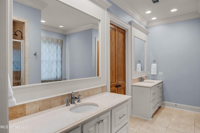 bathroom featuring vanity, crown molding, tile patterned floors, and tiled shower