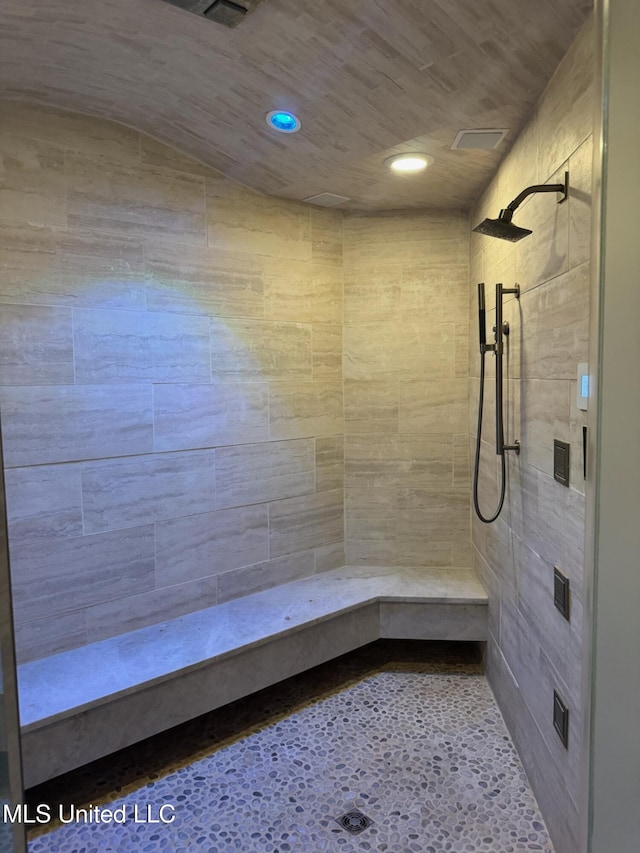 bathroom with a sauna, recessed lighting, and tiled shower