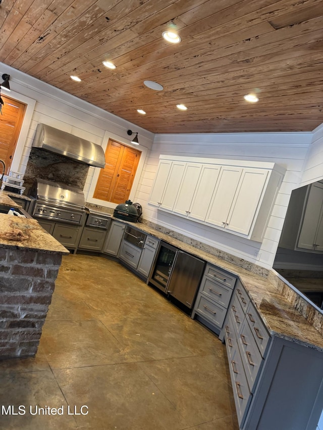 kitchen with recessed lighting, stone countertops, gray cabinetry, wood ceiling, and wall chimney range hood