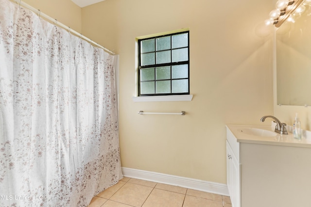 bathroom with tile patterned flooring and vanity