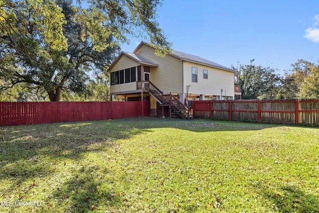 back of house with a yard