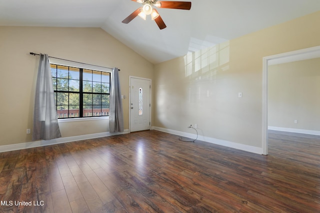 unfurnished room with dark hardwood / wood-style floors, vaulted ceiling, and ceiling fan