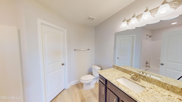 7881 Gardendale Dr, Olive Branch, MS 38654 - full bath featuring wood finished floors, vanity, and bathing tub / shower combination