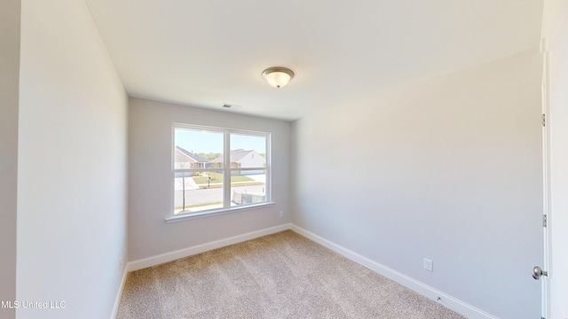 7881 Gardendale Dr, Olive Branch, MS 38654 - spare room with baseboards and carpet floors