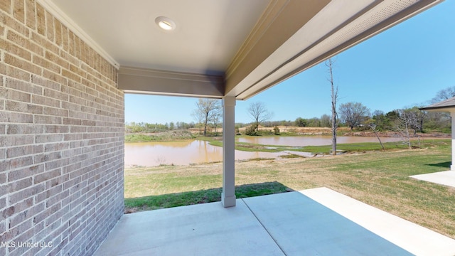 7881 Gardendale Dr, Olive Branch, MS 38654 - view of patio featuring a water view