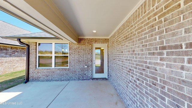 7881 Gardendale Dr, Olive Branch, MS 38654 - doorway to property with brick siding and a patio