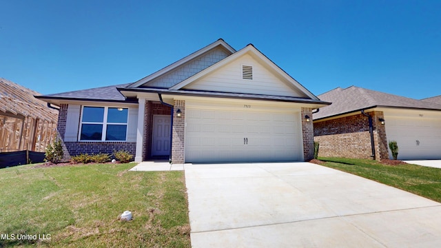 7881 Gardendale Dr, Olive Branch, MS 38654 - ranch-style home with brick siding, a front lawn, an attached garage, driveway, and roof with shingles