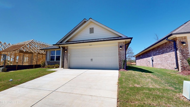 7881 Gardendale Dr, Olive Branch, MS 38654 - ranch-style house featuring brick siding, a front yard, and driveway
