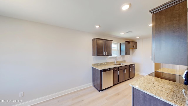 7881 Gardendale Dr, Olive Branch, MS 38654 - kitchen with dishwasher, dark brown cabinets, light wood-type flooring, light stone counters, and recessed lighting