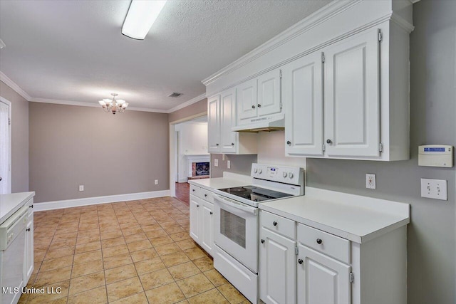 128 Chestnut Dr, Brandon, MS 39047 - kitchen with electric stove, under cabinet range hood, a chandelier, light countertops, and white cabinetry