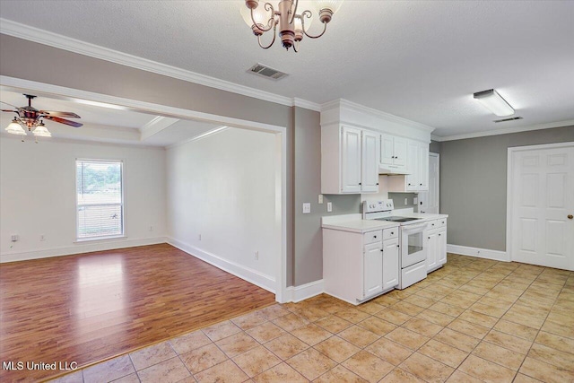 128 Chestnut Dr, Brandon, MS 39047 - kitchen featuring white electric stove, light countertops, crown molding, white cabinetry, and under cabinet range hood