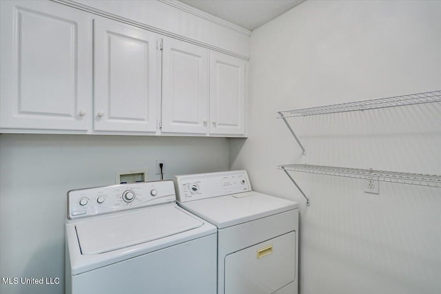 128 Chestnut Dr, Brandon, MS 39047 - laundry area featuring washing machine and clothes dryer and cabinet space