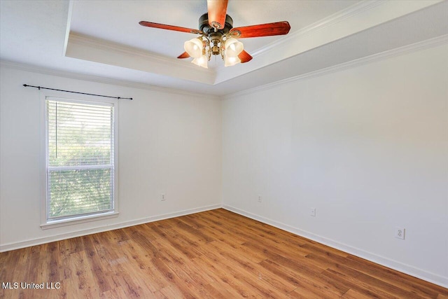 128 Chestnut Dr, Brandon, MS 39047 - unfurnished room with a tray ceiling, light wood-type flooring, crown molding, a ceiling fan, and baseboards