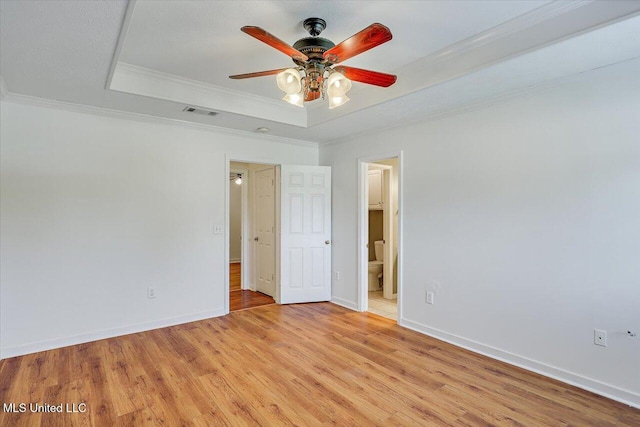128 Chestnut Dr, Brandon, MS 39047 - unfurnished room with a tray ceiling, a ceiling fan, light wood-style flooring, ornamental molding, and baseboards