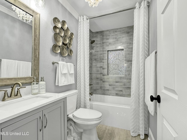 239 Palmetto Ln, Gulfport, MS 39507 - bathroom with shower / bath combo with shower curtain, vanity, toilet, and wood finished floors