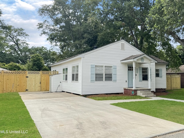 239 Palmetto Ln, Gulfport, MS 39507 - view of front of property with a gate and concrete driveway