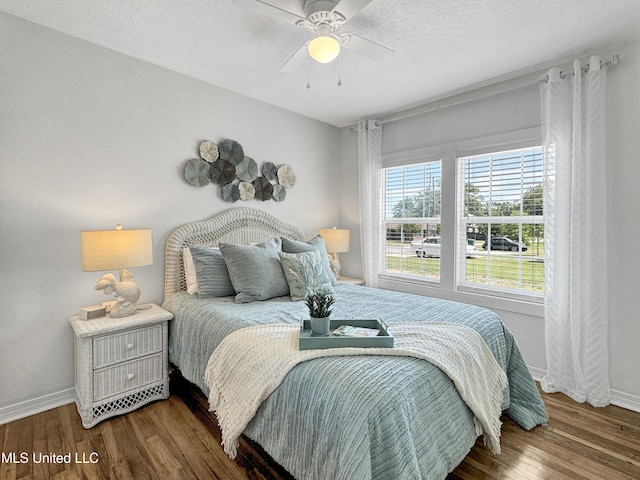 239 Palmetto Ln, Gulfport, MS 39507 - bedroom featuring wood finished floors, baseboards, ceiling fan, and a textured ceiling