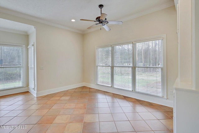 spare room with baseboards, light tile patterned flooring, a ceiling fan, and ornamental molding