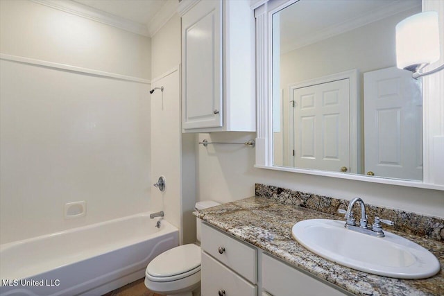 bathroom with tub / shower combination, toilet, ornamental molding, and vanity