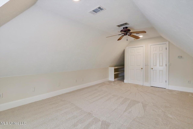 bonus room featuring visible vents, carpet, and lofted ceiling