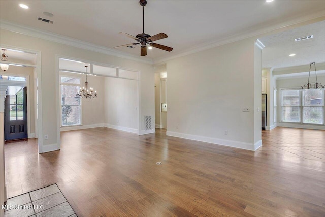 unfurnished living room with a healthy amount of sunlight and visible vents