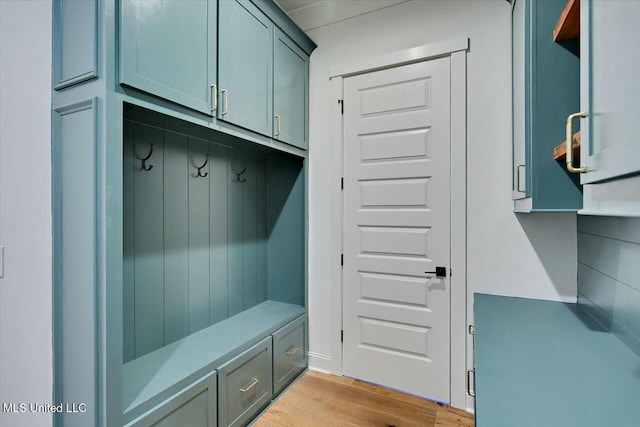 mudroom with light wood finished floors