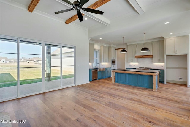 kitchen featuring light wood-type flooring, beam ceiling, dishwasher, and decorative backsplash