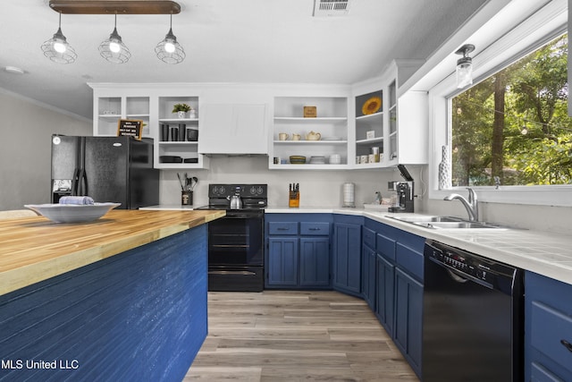 114 Olson Ave, Long Beach, MS 39560 - kitchen featuring black appliances, open shelves, blue cabinets, wooden counters, and ornamental molding