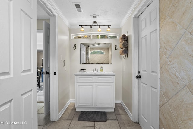 114 Olson Ave, Long Beach, MS 39560 - bathroom with crown molding, vanity, and baseboards