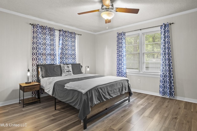 114 Olson Ave, Long Beach, MS 39560 - bedroom featuring ornamental molding, wood finished floors, a textured ceiling, baseboards, and ceiling fan