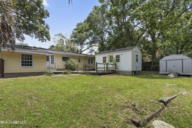 114 Olson Ave, Long Beach, MS 39560 - back of property with a yard and a deck
