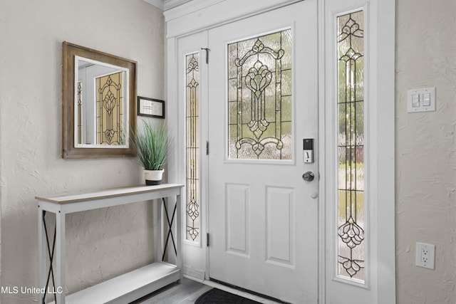 114 Olson Ave, Long Beach, MS 39560 - entryway with plenty of natural light, a textured wall, and wood finished floors