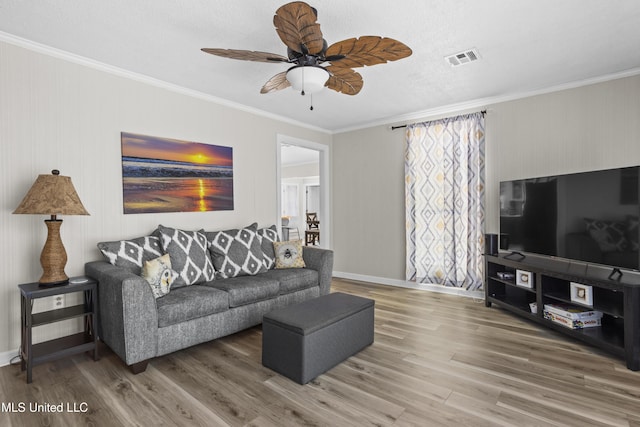 114 Olson Ave, Long Beach, MS 39560 - living room featuring crown molding, wood finished floors, a ceiling fan, and baseboards
