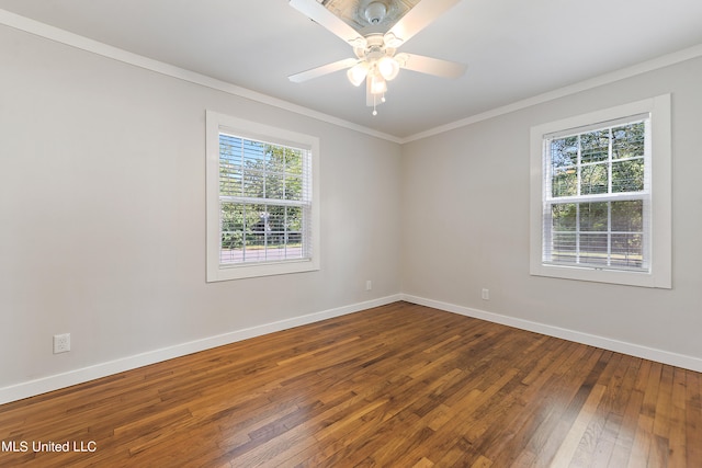 empty room with ceiling fan, hardwood / wood-style flooring, and crown molding