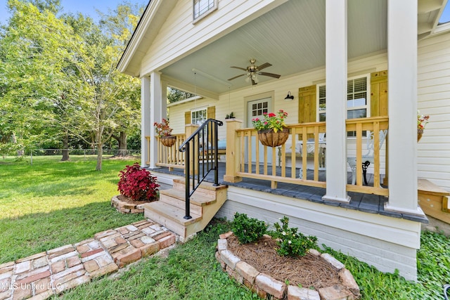 exterior space with ceiling fan, a lawn, and a porch