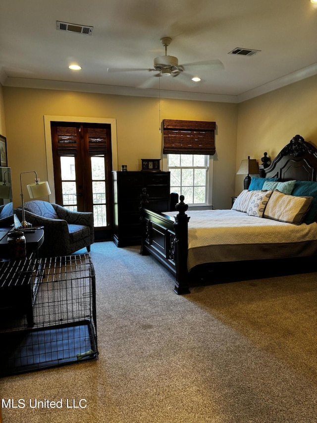 bedroom with crown molding, french doors, ceiling fan, and carpet flooring