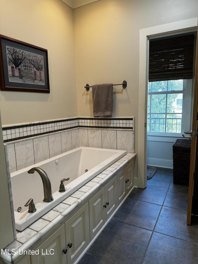 bathroom featuring tile patterned floors and a bathing tub