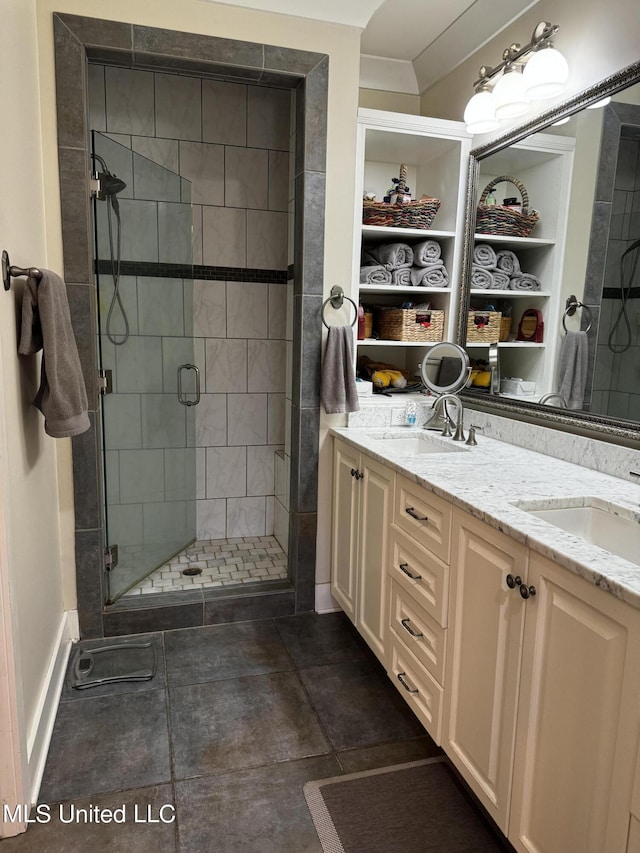 bathroom with an enclosed shower and vanity