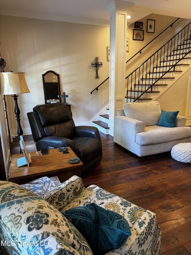 living room featuring crown molding and dark hardwood / wood-style floors