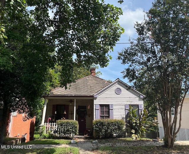 bungalow with a porch and ceiling fan