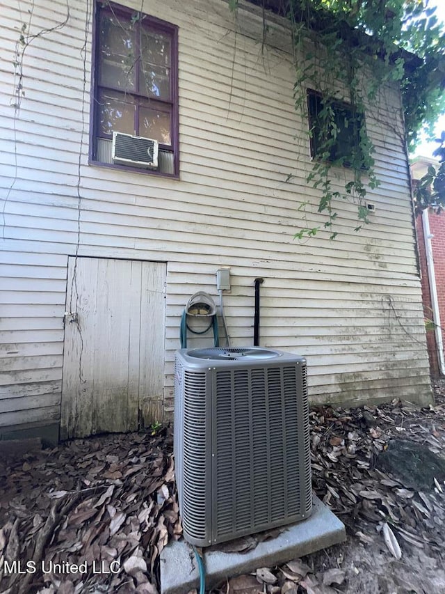 2413 Cherry St, Vicksburg, MS 39180 - view of side of property with central air condition unit and cooling unit