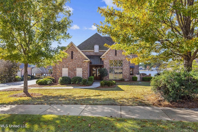 view of front of home with a front yard