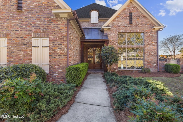 property entrance featuring french doors