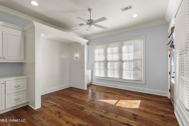 unfurnished dining area with crown molding, ceiling fan, and dark hardwood / wood-style floors