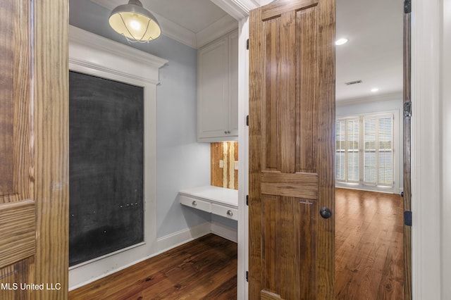 bathroom featuring wood-type flooring and crown molding