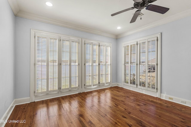 empty room featuring hardwood / wood-style floors, ceiling fan, and crown molding